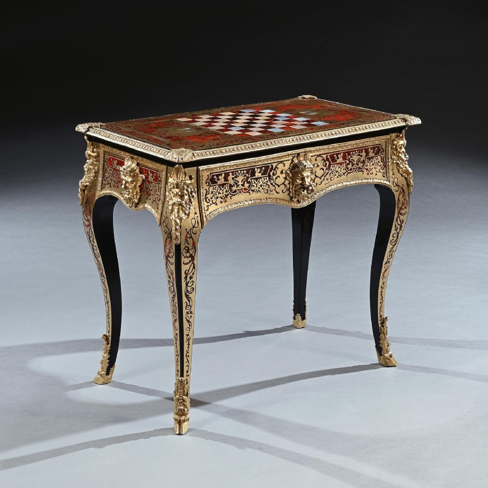 A George IV period Boulle marquetry games table featuring brass and tortoiseshell inlay, gilt-bronze mounts, cabriole legs, and an inlaid chessboard top. View IV