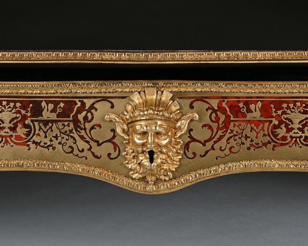 A George IV period Boulle marquetry games table featuring brass and tortoiseshell inlay, gilt-bronze mounts, cabriole legs, and an inlaid chessboard top. View V