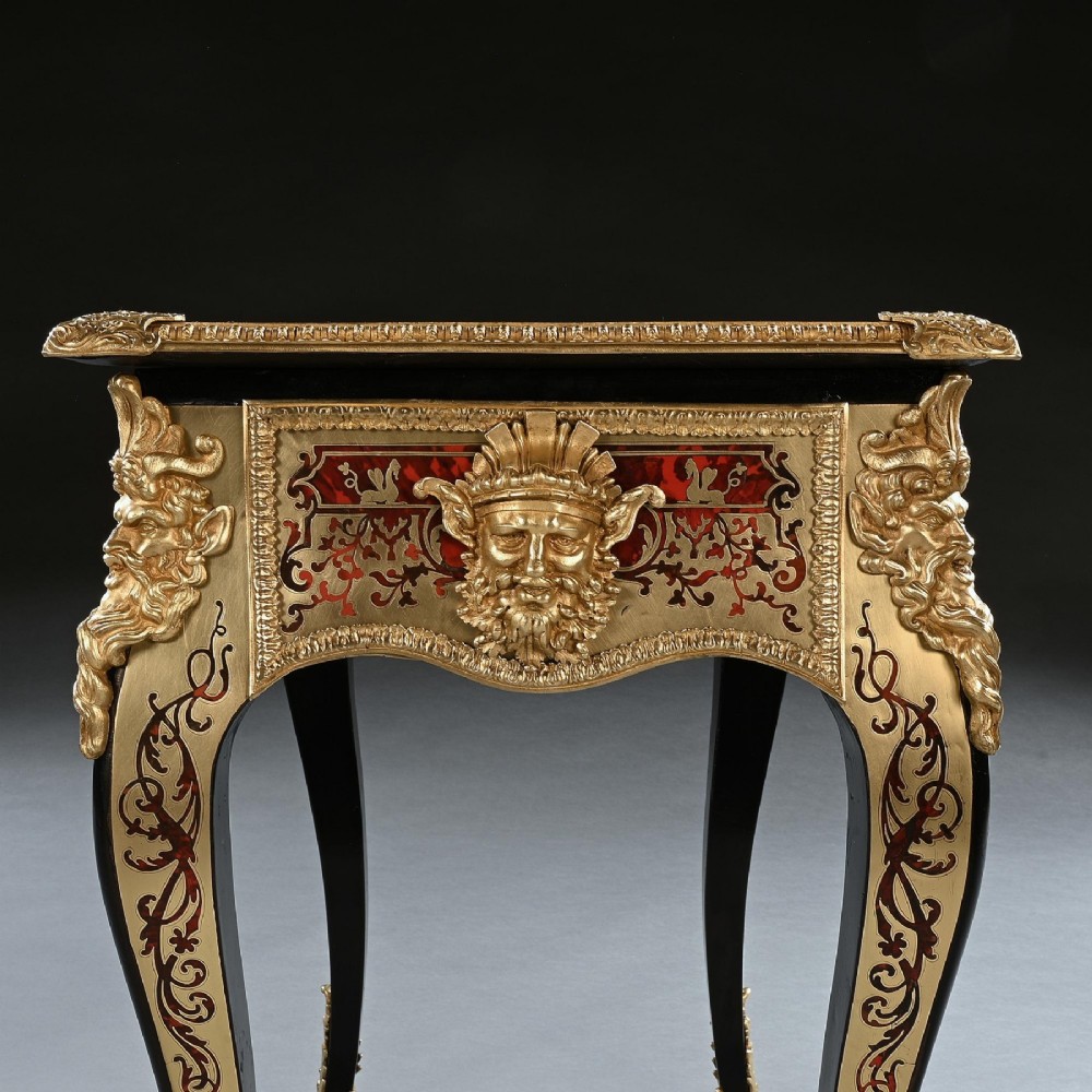 A George IV period Boulle marquetry games table featuring brass and tortoiseshell inlay, gilt-bronze mounts, cabriole legs, and an inlaid chessboard top. View VII