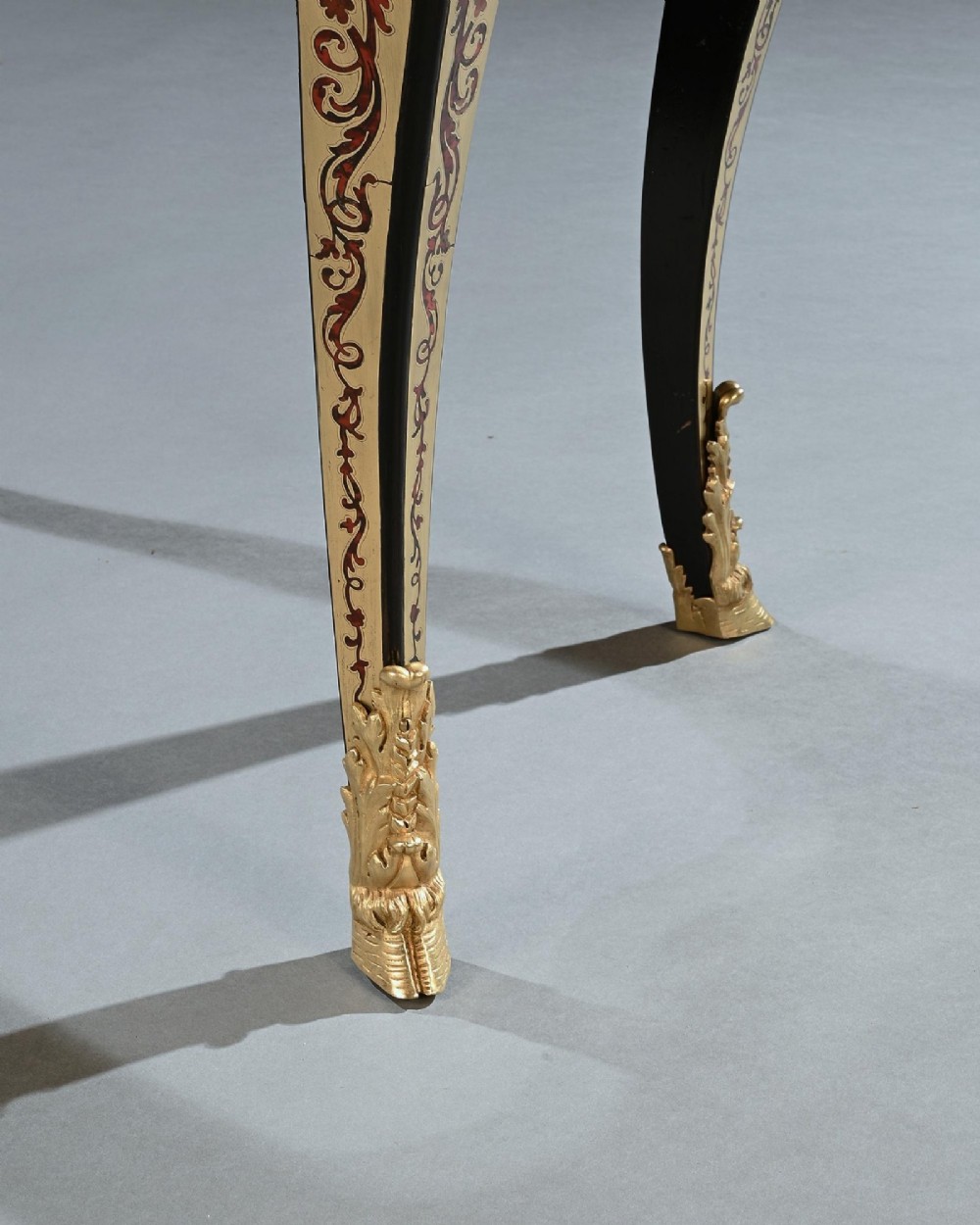 A George IV period Boulle marquetry games table featuring brass and tortoiseshell inlay, gilt-bronze mounts, cabriole legs, and an inlaid chessboard top. View IX
