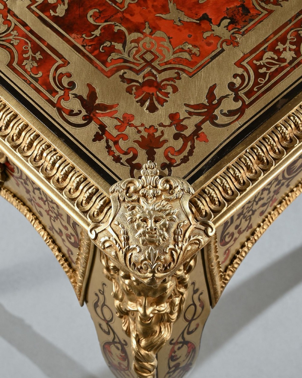 A George IV period Boulle marquetry games table featuring brass and tortoiseshell inlay, gilt-bronze mounts, cabriole legs, and an inlaid chessboard top. View XI