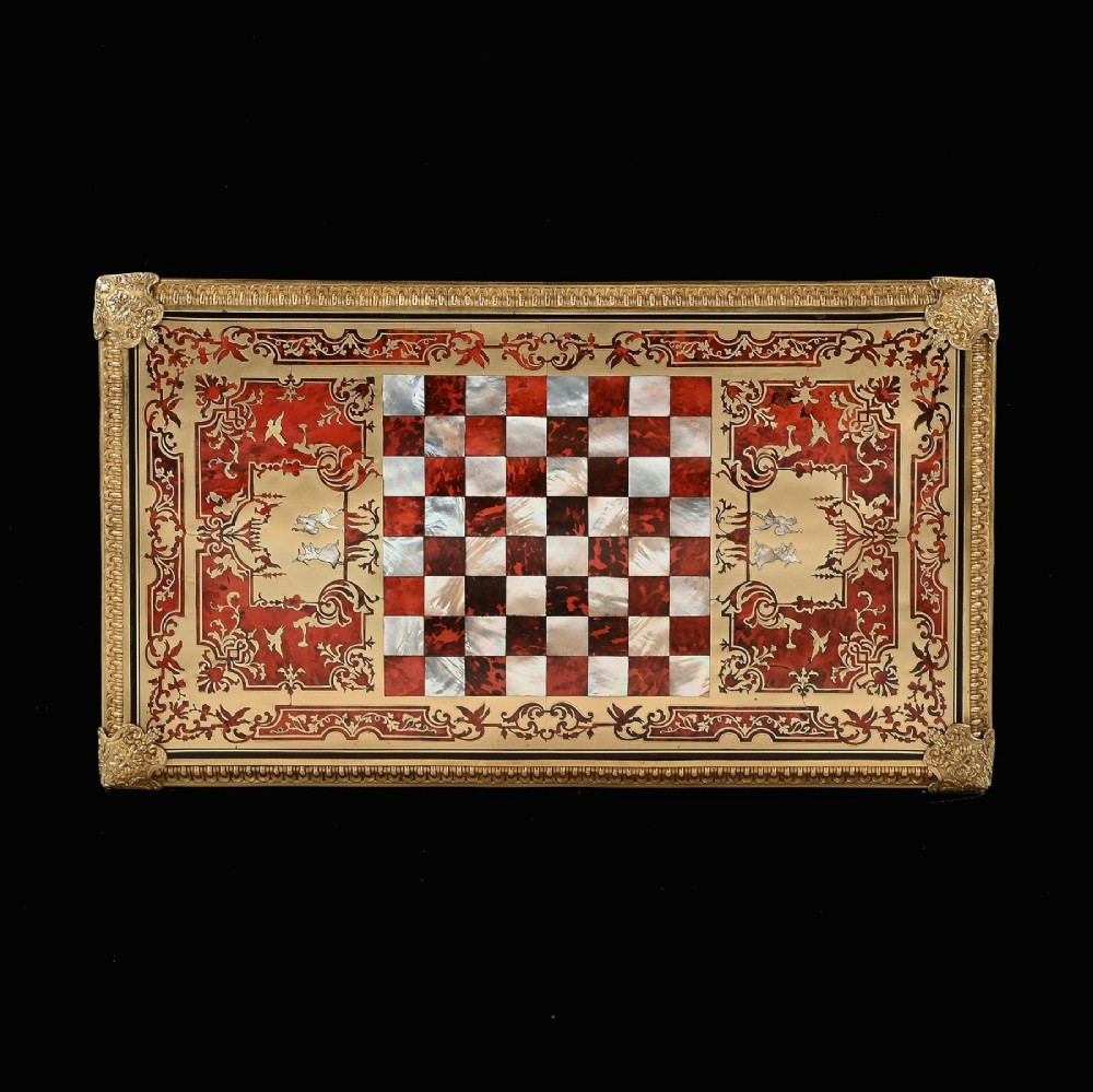 A George IV period Boulle marquetry games table featuring brass and tortoiseshell inlay, gilt-bronze mounts, cabriole legs, and an inlaid chessboard top. View XIII