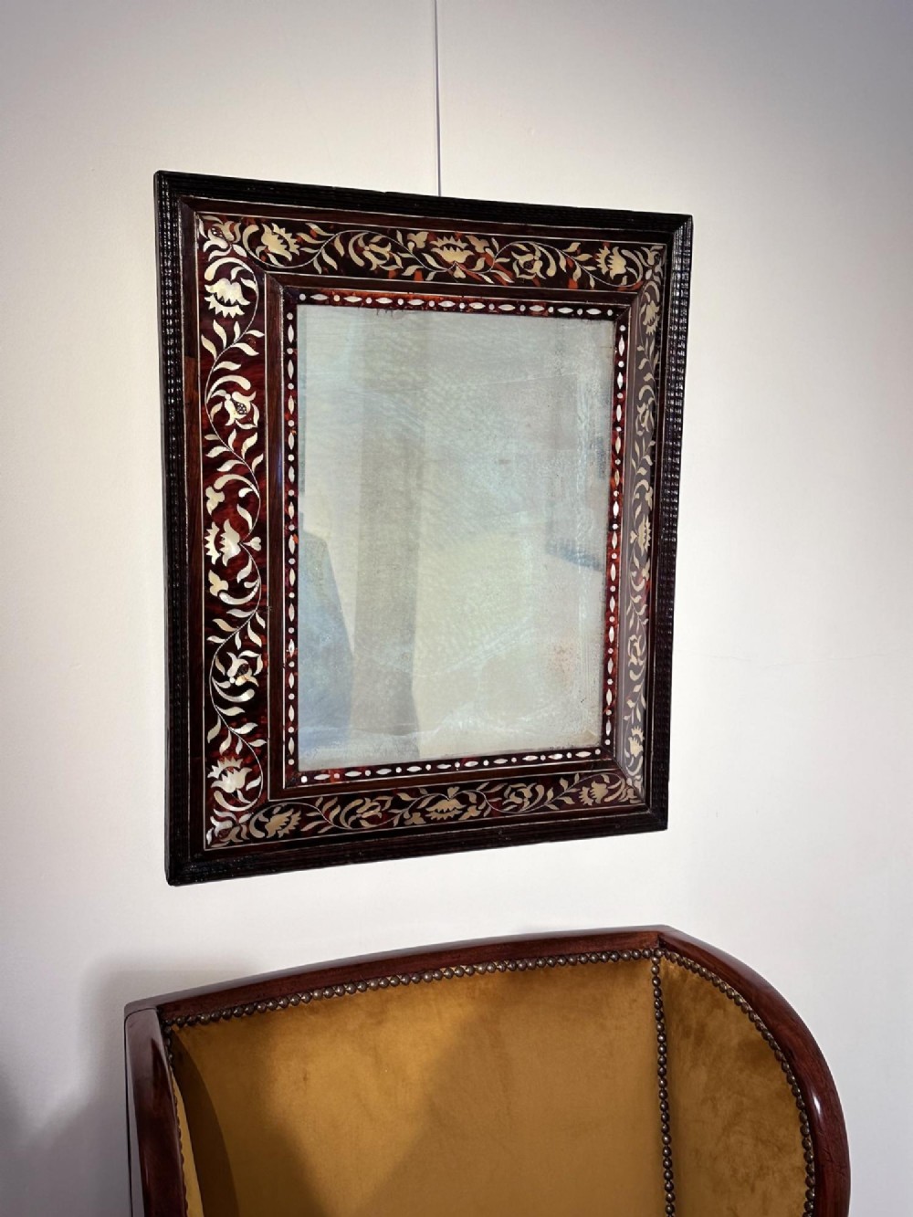 A pair of 18th-century rectangular wall mirrors featuring rich brown tortoiseshell frames intricately inlaid with mother-of-pearl floral motifs. View V