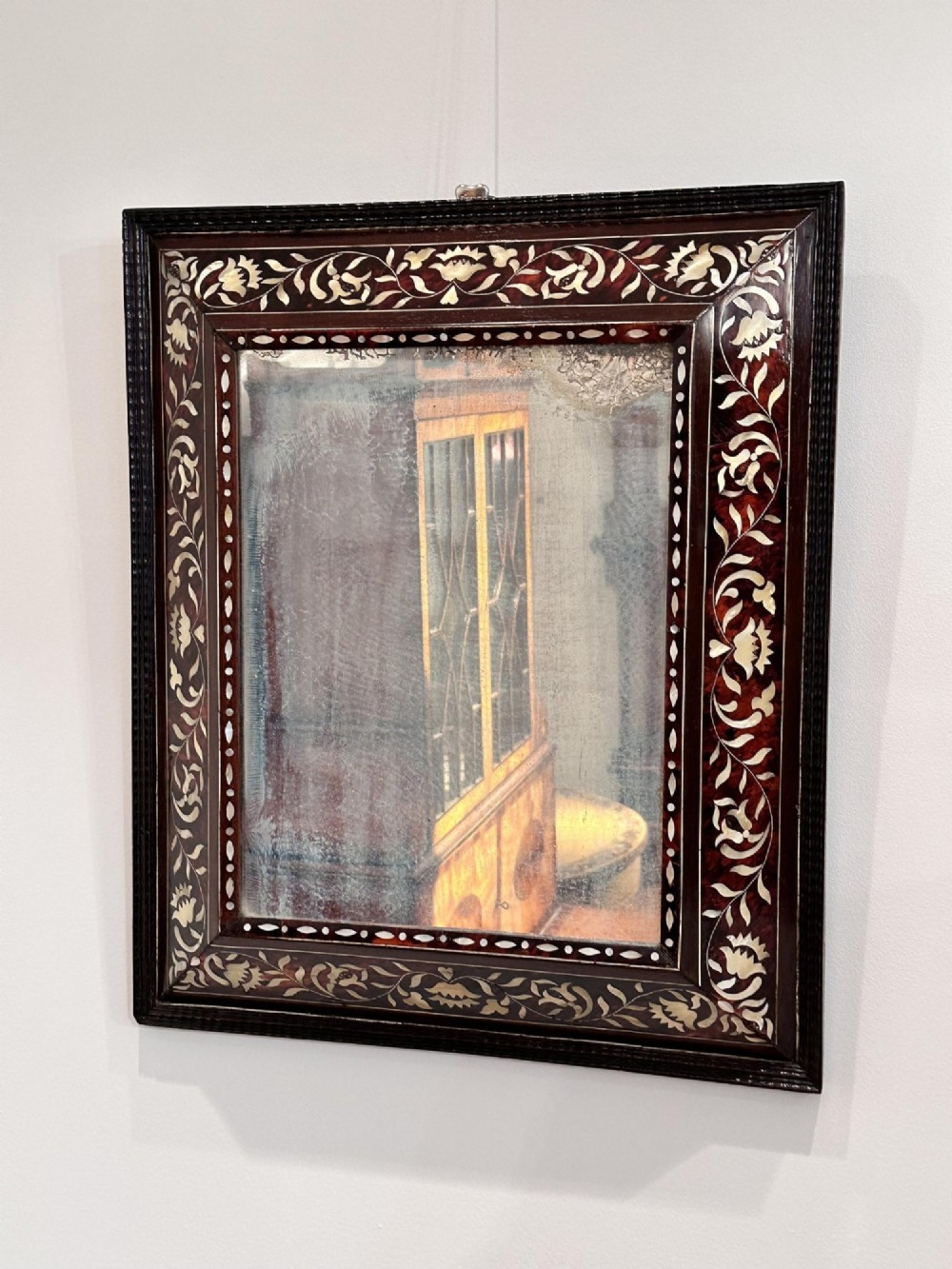 A pair of 18th-century rectangular wall mirrors featuring rich brown tortoiseshell frames intricately inlaid with mother-of-pearl floral motifs. View VI