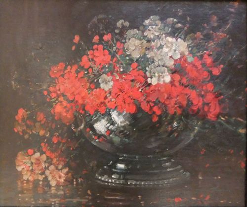 fig 1. An oil painting depicting red and white flowers in a pedestal bowl, presented inside a deeply carved gilded frame.