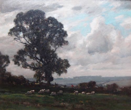 fig 1. An impressionist landscape oil painting on canvas depicting sheep grazing in a green field under a cloudy sky, set within a carved gilt frame.