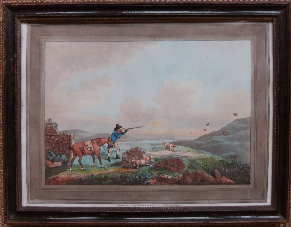 A pair of framed Georgian sporting prints depicting figures with guns and working dogs in open landscapes, housed within dark wood frames. View II