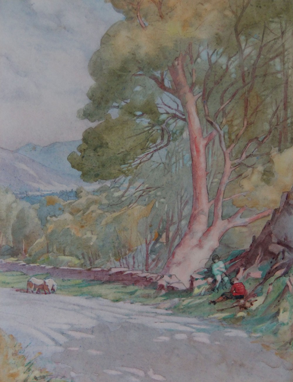 A watercolour landscape painting depicting a tree-lined road in a Welsh valley with figures seated under a large tree.