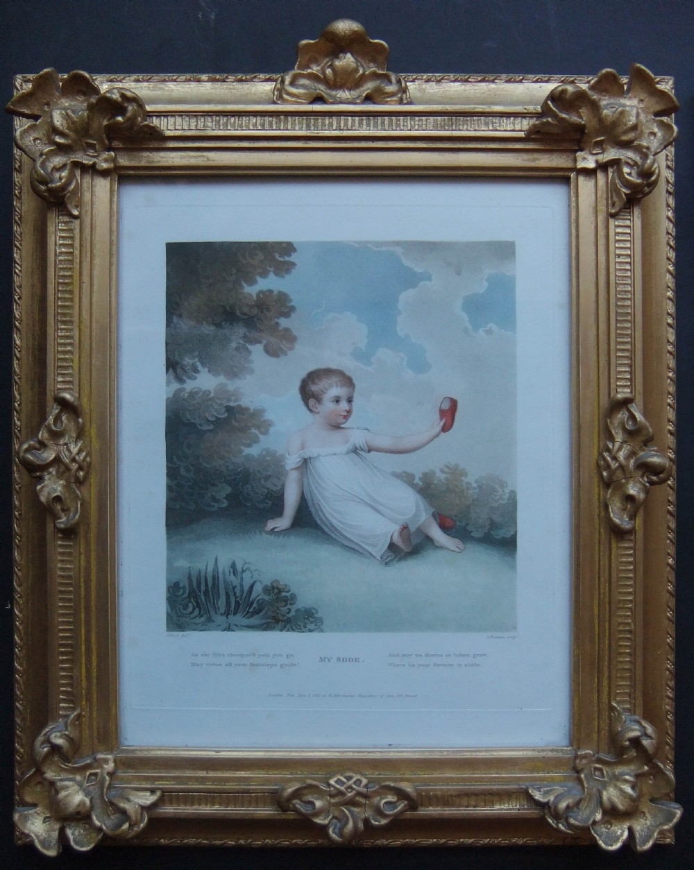 A pair of Regency coloured engravings depicting young children in white dresses, presented in matching ornate giltwood frames. View II