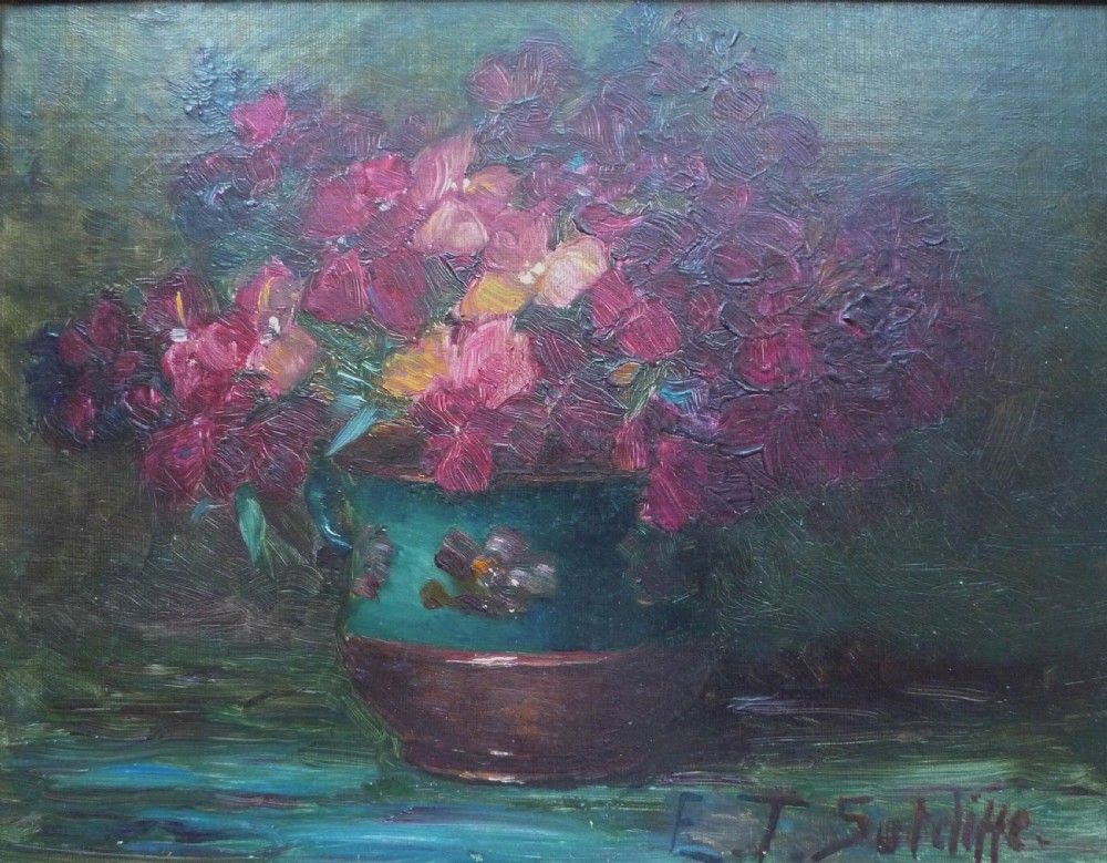 An antique oil painting depicting vibrant magenta flowers arranged in a green ceramic jar against a dark background, signed E. T. Sutcliffe.