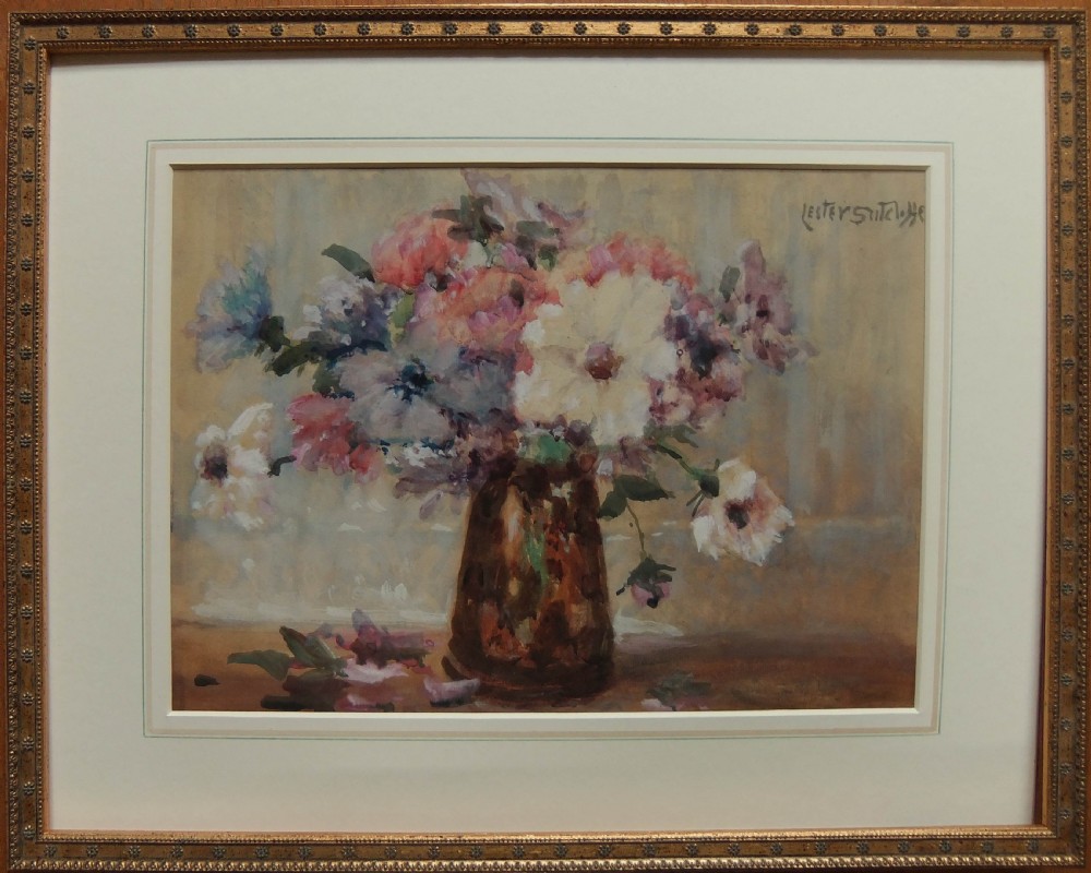 A watercolour painting depicting a vase filled with anemone blossoms in shades of pink, white, and purple against a neutral background, signed by Lester Sutcliffe. View II