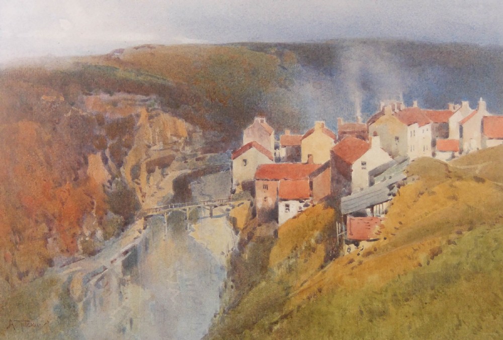 An original watercolour painting depicting a cliffside village with red-roofed cottages and a bridge over a river valley by Arthur Tucker.