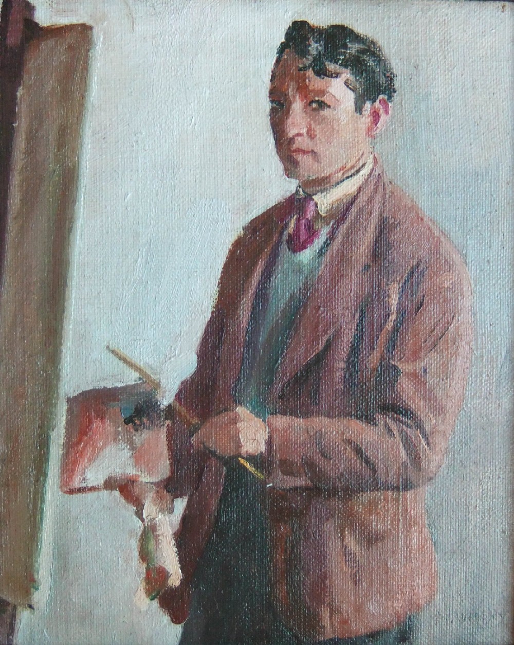 An oil painting depicting a male artist holding an artist palette in front of an easel within a carved gold leaf frame. View II