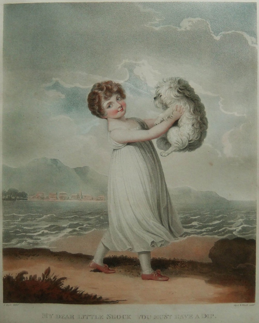 A framed early 19th-century colour engraving by Adam Buck depicting a child holding a dog near the sea, set within a glazed gilt wood frame. View III