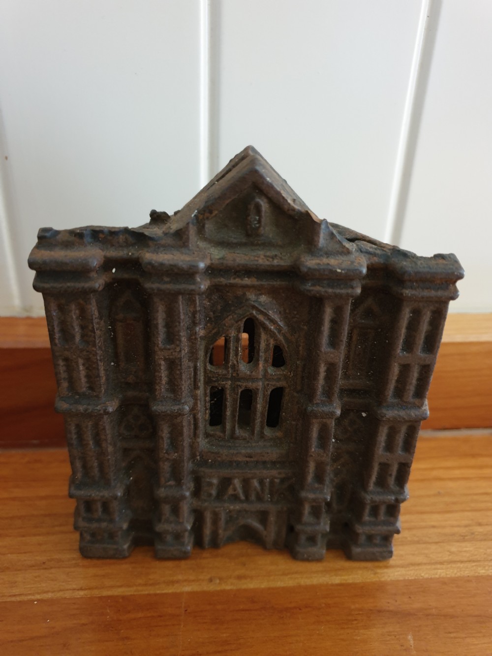 A LATE 19THC CAST IRON MONEY BANK IN THE FORM OF A GOTHIC BANK View II