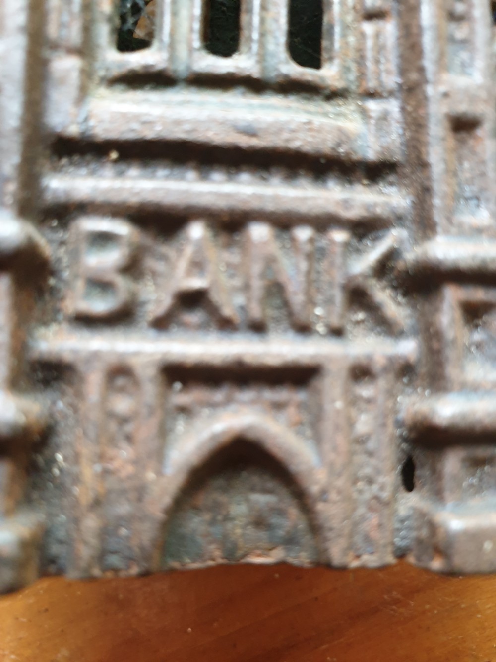 A LATE 19THC CAST IRON MONEY BANK IN THE FORM OF A GOTHIC BANK View III