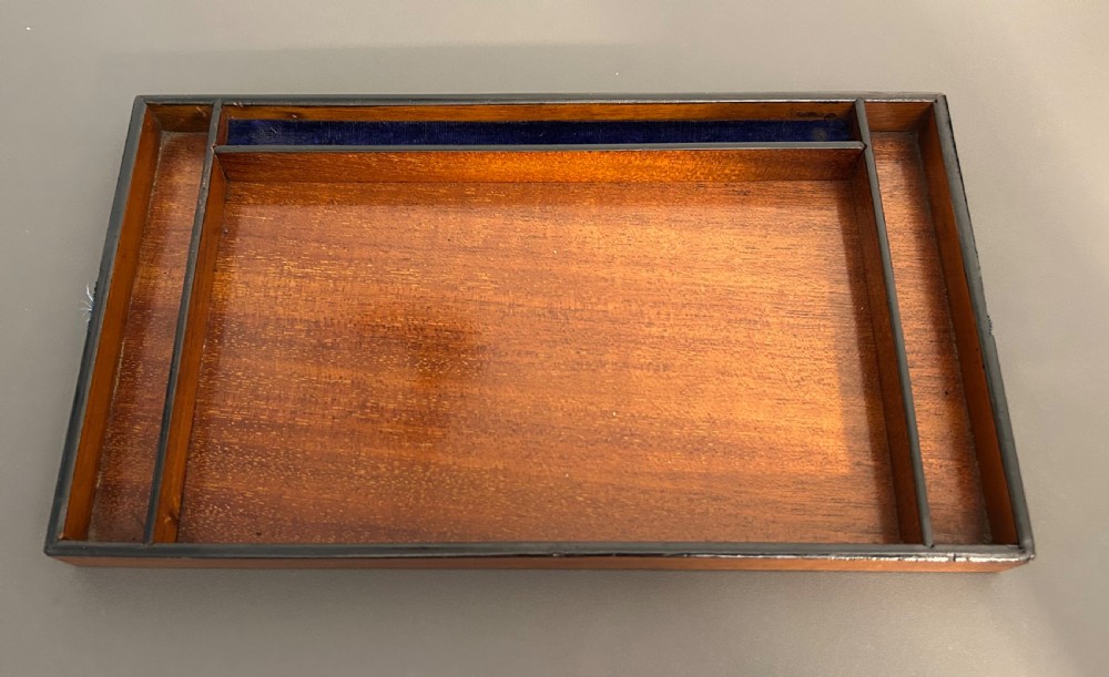 A rectangular Victorian burr walnut box featuring rounded edges, a mother-of-pearl central cartouche inlay, and a matching keyhole escutcheon. View XIII