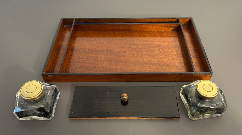 A rectangular Victorian burr walnut box featuring rounded edges, a mother-of-pearl central cartouche inlay, and a matching keyhole escutcheon. View XIV