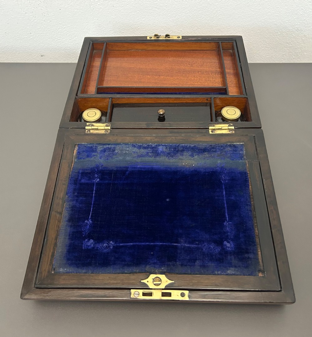 A rectangular Victorian burr walnut box featuring rounded edges, a mother-of-pearl central cartouche inlay, and a matching keyhole escutcheon. View XVI