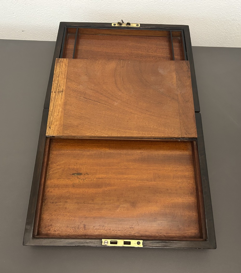 A rectangular Victorian burr walnut box featuring rounded edges, a mother-of-pearl central cartouche inlay, and a matching keyhole escutcheon. View XVII