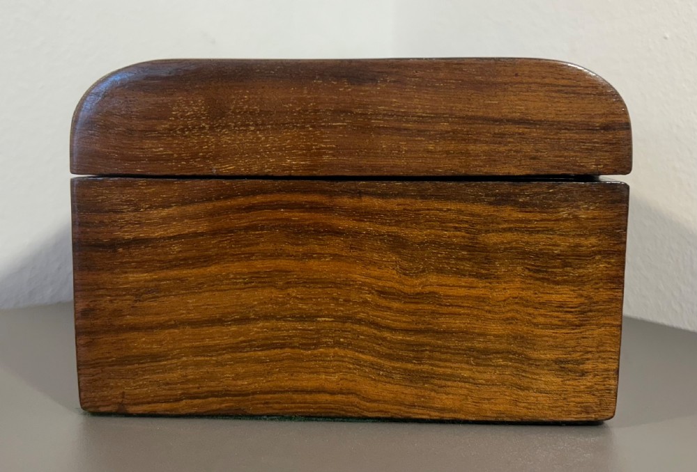Victorian burr walnut wooden box with a geometric mosaic inlay border, central mother of pearl lozenge motif, and key in the front lock. View IV
