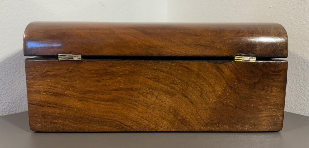 Victorian burr walnut wooden box with a geometric mosaic inlay border, central mother of pearl lozenge motif, and key in the front lock. View VI