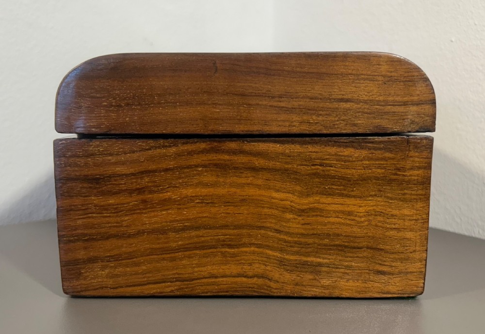 Victorian burr walnut wooden box with a geometric mosaic inlay border, central mother of pearl lozenge motif, and key in the front lock. View VII