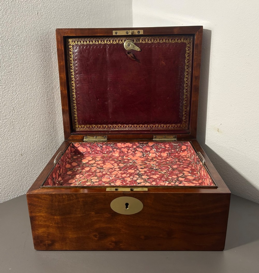 A rectangular Victorian plum mahogany jewellery box featuring a brass oval top cartouche and a matching brass keyhole escutcheon. View XI