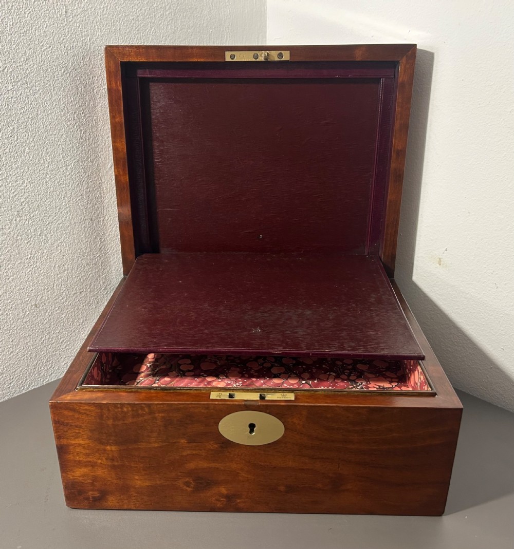 A rectangular Victorian plum mahogany jewellery box featuring a brass oval top cartouche and a matching brass keyhole escutcheon. View XIII
