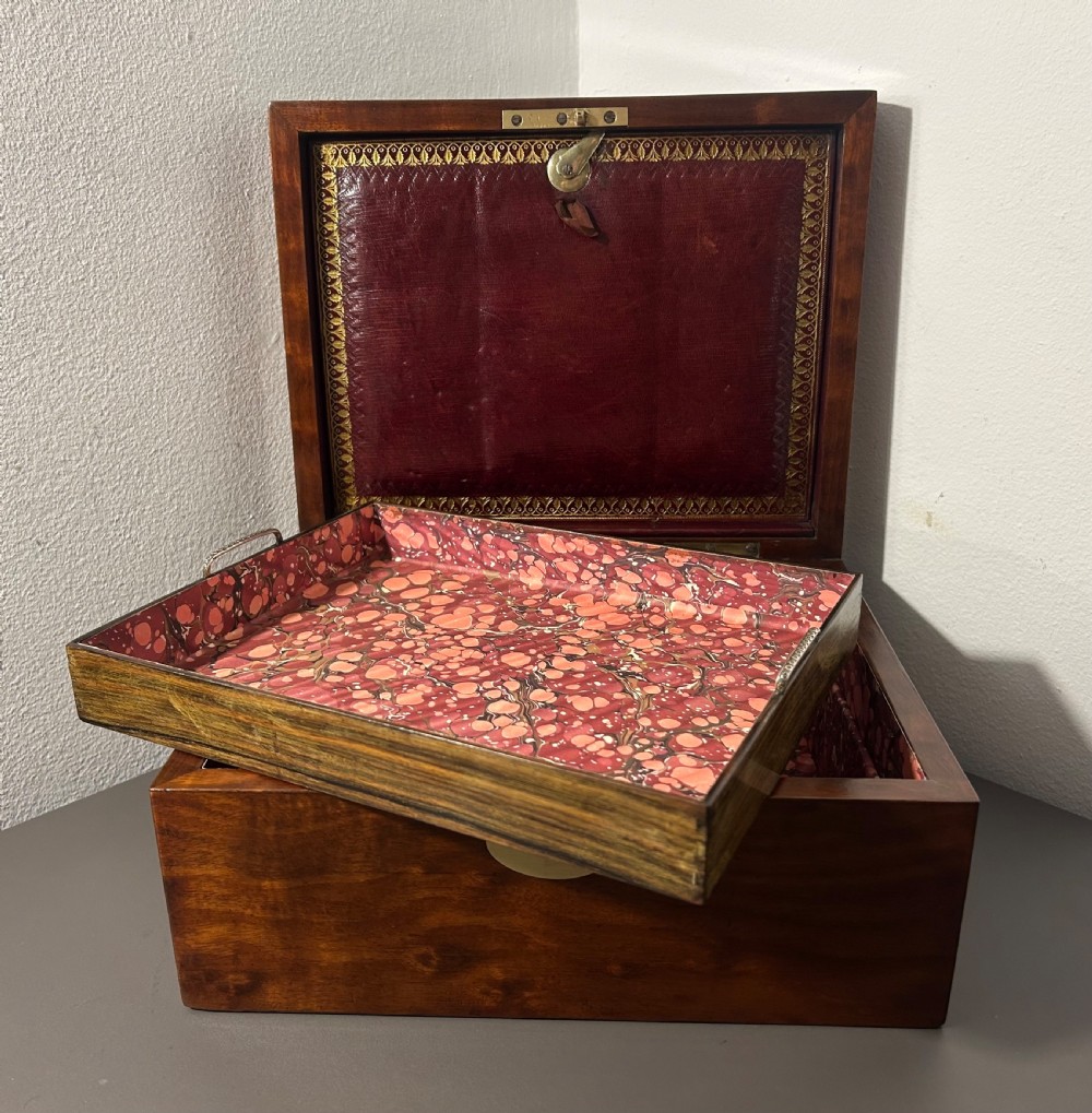A rectangular Victorian plum mahogany jewellery box featuring a brass oval top cartouche and a matching brass keyhole escutcheon. View XIV