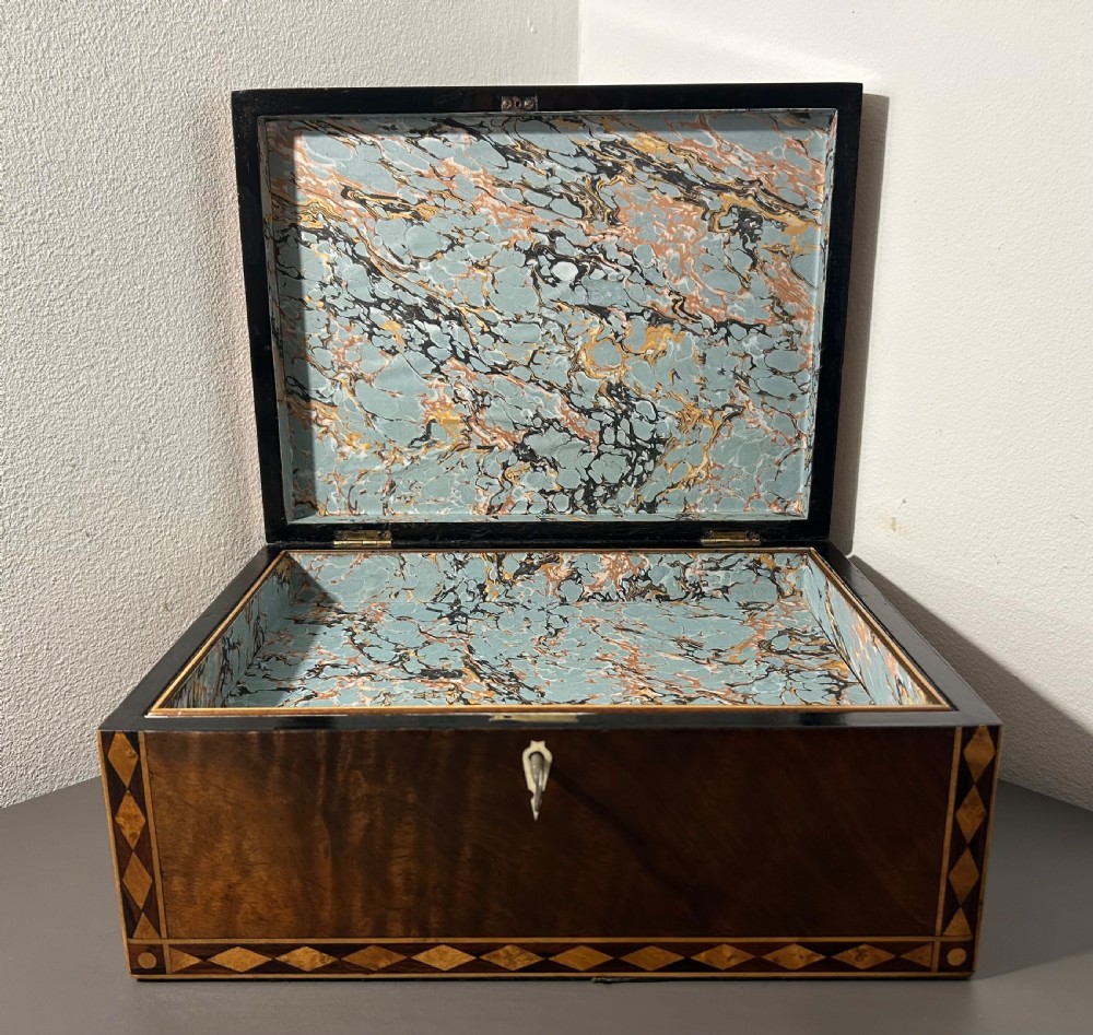 A rectangular Victorian specimen wood box featuring geometric parquetry inlay, a central heart motif on the lid, and a keyhole on the front. View XI