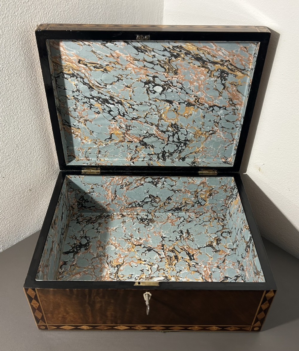 A rectangular Victorian specimen wood box featuring geometric parquetry inlay, a central heart motif on the lid, and a keyhole on the front. View XIV
