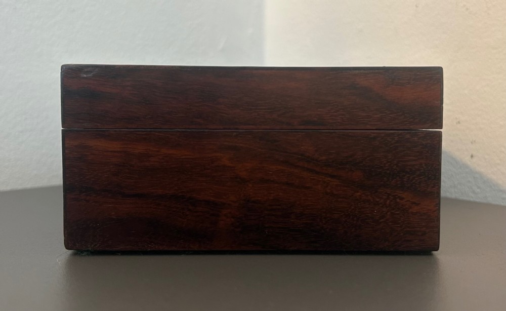 A rectangular Victorian table box featuring highly figured laburnum wood veneer and a central keyhole with key. View IV
