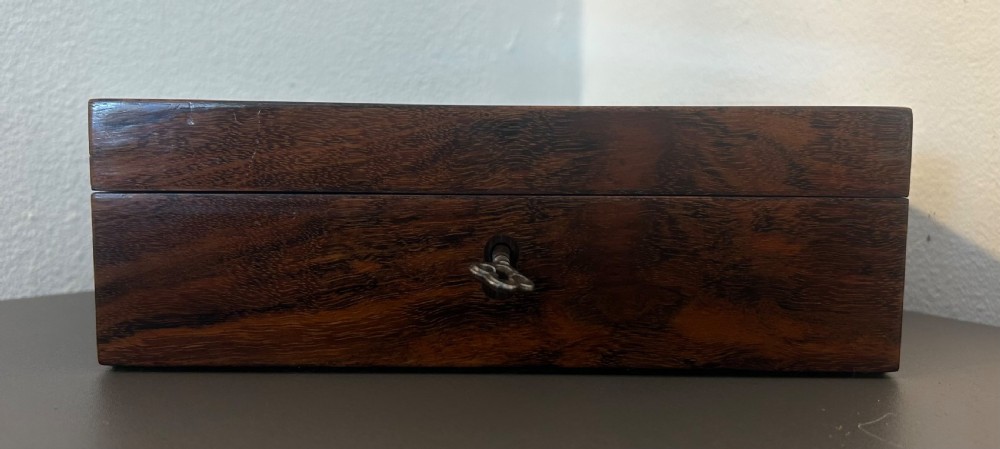 A rectangular Victorian table box featuring highly figured laburnum wood veneer and a central keyhole with key. View VII