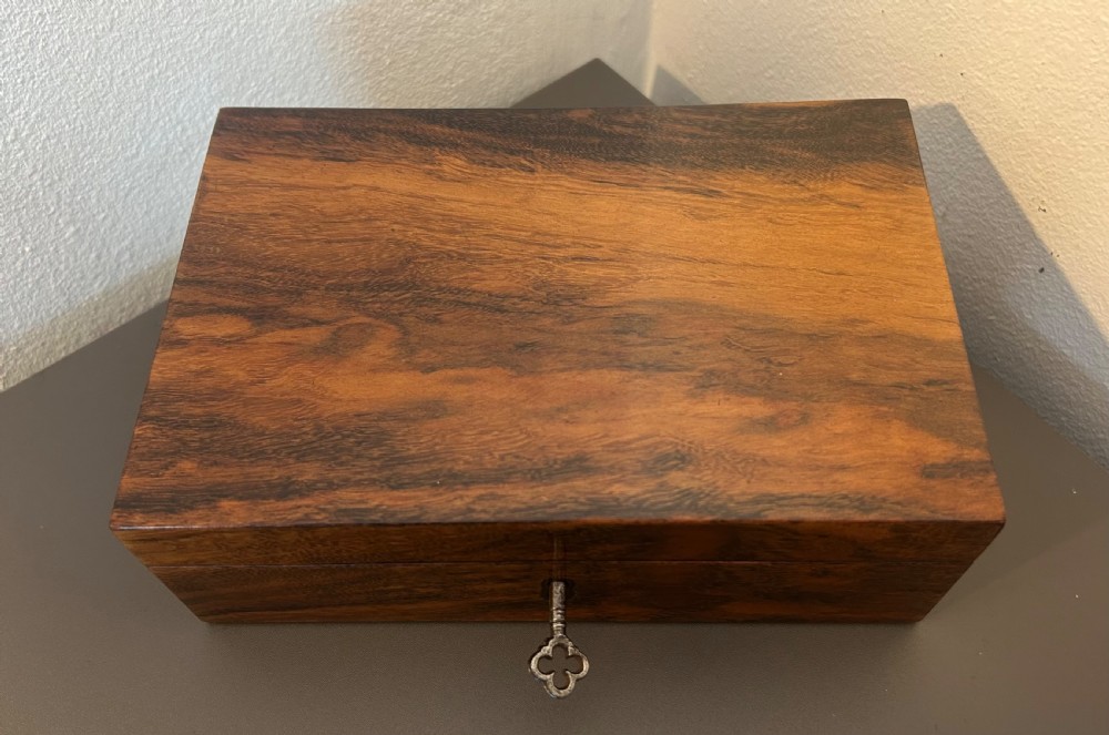 A rectangular Victorian table box featuring highly figured laburnum wood veneer and a central keyhole with key. View VIII
