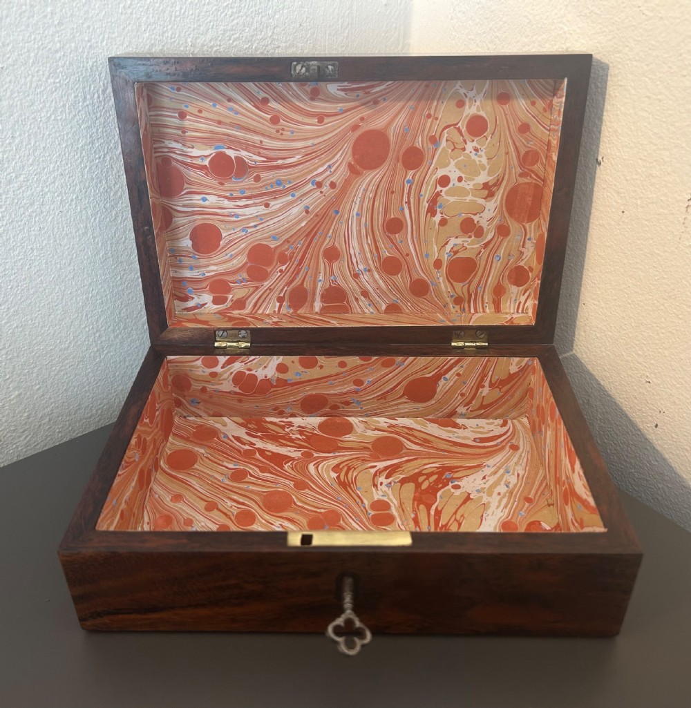 A rectangular Victorian table box featuring highly figured laburnum wood veneer and a central keyhole with key. View XI
