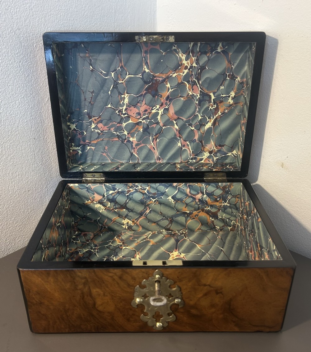 Victorian burr walnut jewellery box featuring ornate engraved brass strapwork and a keyhole escutcheon. View IX