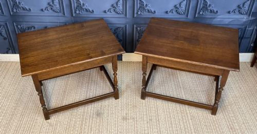 fig 1. A matching pair of dark oak rectangular coffee tables featuring turned legs and low perimeter stretchers.