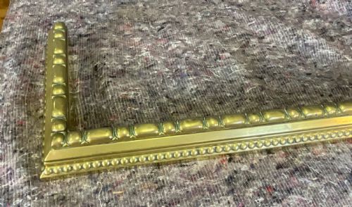 fig 2. A three-sided Victorian polished brass fireplace fender featuring beaded moulding details along its frame.