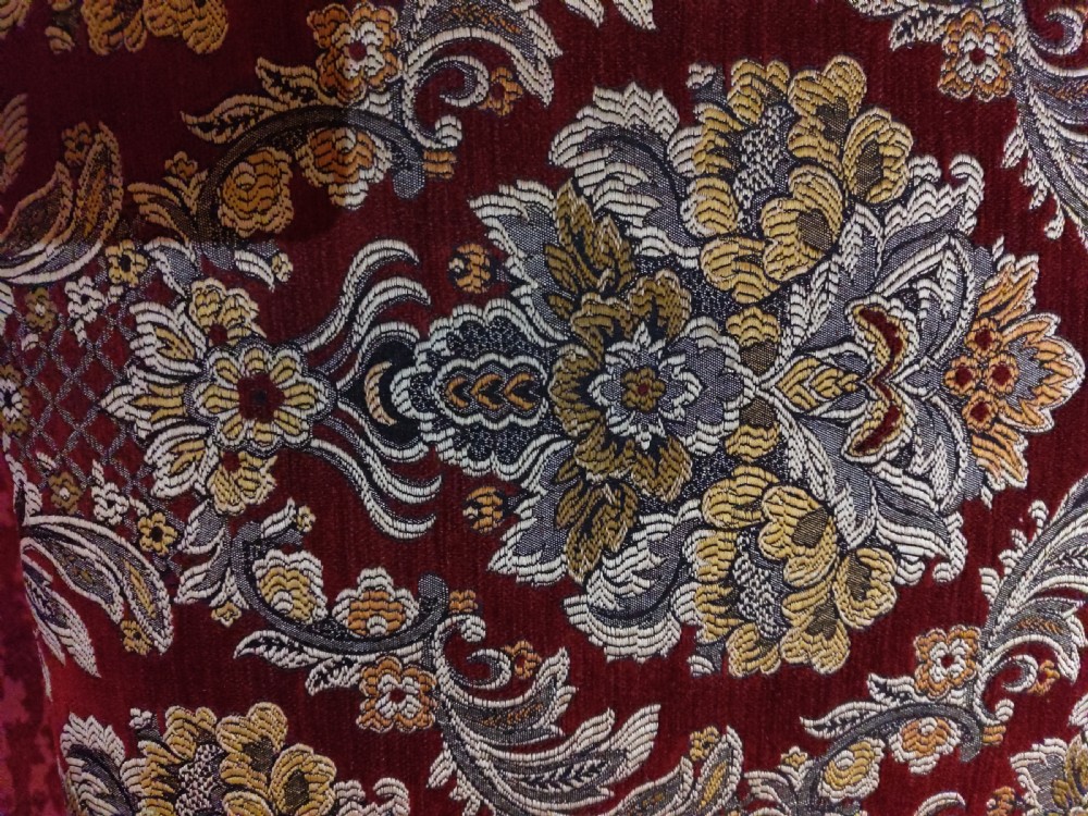 An antique carved walnut piano stool with cabriole legs and a red floral tapestry upholstered top. View III