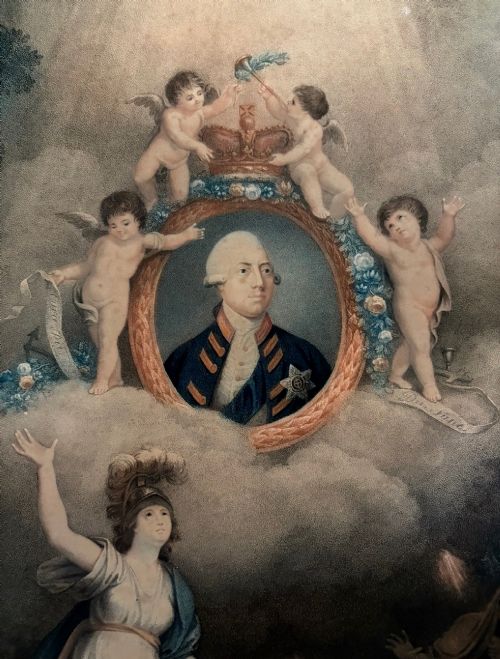 fig 2. A framed 1802 Late-Georgian allegorical print depicting King George III surrounded by cherubs and classical figures within a carved gilt frame.