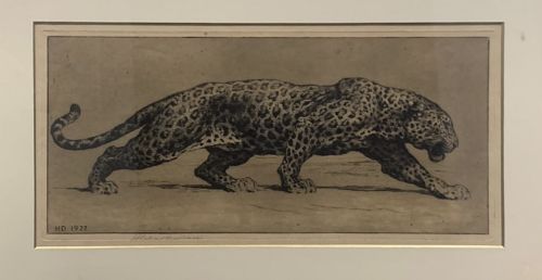 fig 1. A framed monochrome sepia etching depicting a prowling leopard, signed and dated HD 1922 in the plate, set within a cream mount and gilt frame.