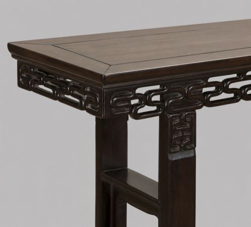 fig 1. A late 19th-century Chinese dark hardwood altar table with an openwork geometric carved apron and recessed leg stretchers.