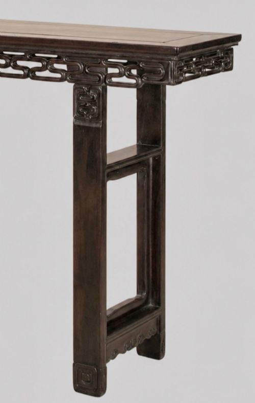 fig 2. A late 19th-century Chinese dark hardwood altar table with an openwork geometric carved apron and recessed leg stretchers.