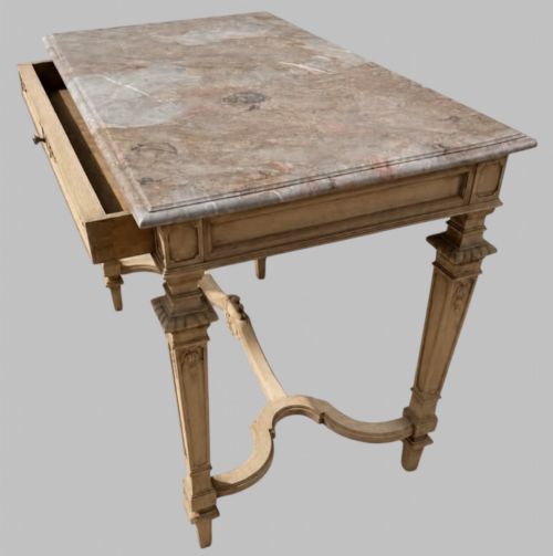 fig 1. A late 19th-century French side table with a grey marble top, carved pale timber frame, single frieze drawer, and shaped central stretcher.