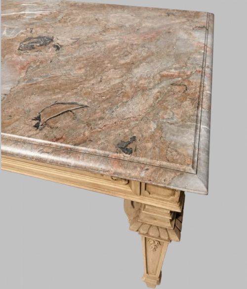 fig 2. A late 19th-century French side table with a grey marble top, carved pale timber frame, single frieze drawer, and shaped central stretcher.