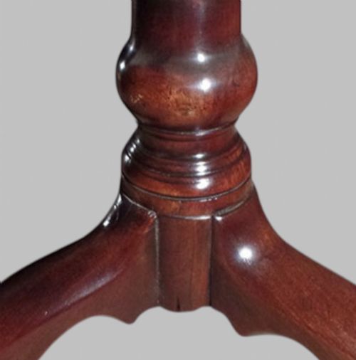 fig 2. A Georgian mahogany tilt-top occasional table featuring a circular surface supported by a turned pedestal stem and tripod cabriole legs.