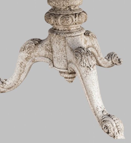 fig 3. A circular mid-19th-century centre table featuring a bleached mahogany top supported by a carved tripod pedestal base.