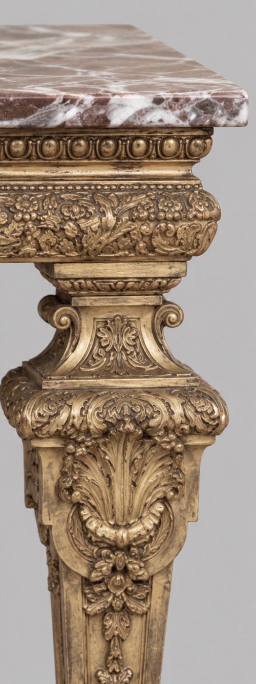 A pair of 19th-century Italian giltwood console tables featuring carved tapered legs and fitted marble tops. View VI