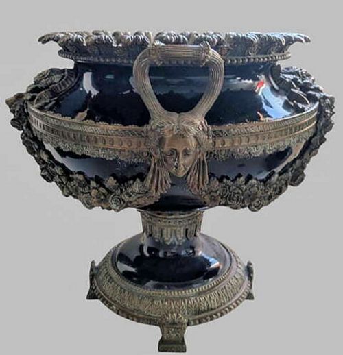 fig 2. A pair of 19th-century dark blue ceramic jardinieres featuring ornate gilt metal mounts, dual scroll handles, and flared pedestal bases.